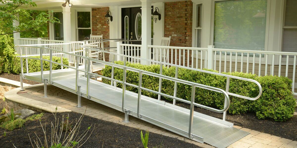 Wheelchair ramp outside front door of home