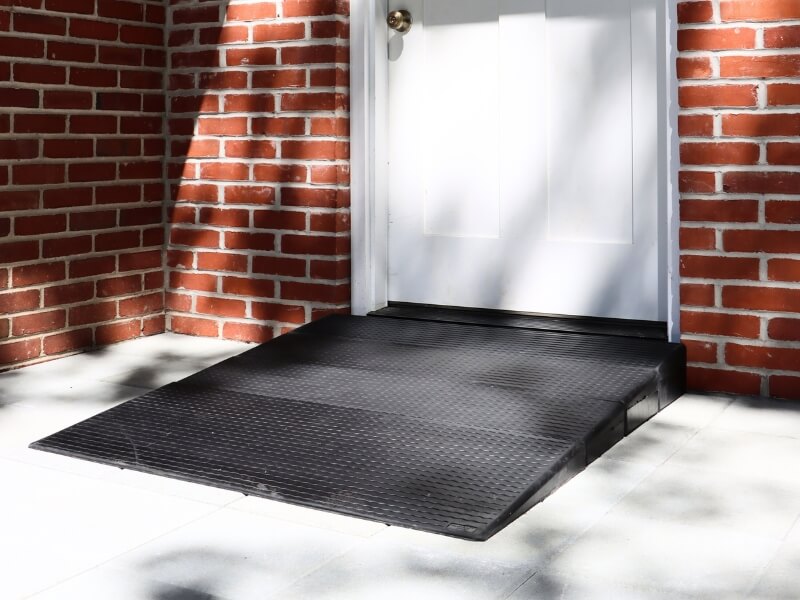 rubber threshold ramp in front of the front door of a house