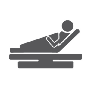 Icon of a person reclining on an adjustable bed, shown in a side view with the upper body elevated and legs supported.