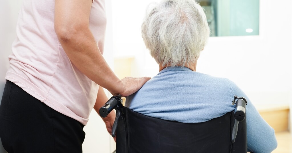 Caregiver Helping Woman