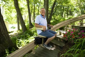 A man using a Bruno outdoor stairlift