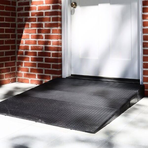 Rubber threshold ramp in front of a front door of a house